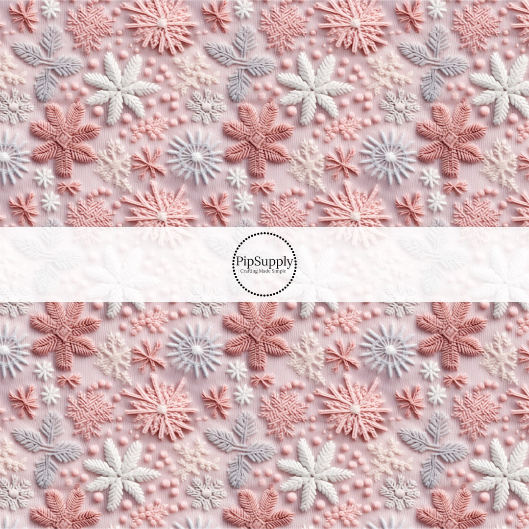 These holiday sewn pattern themed fabric by the yard features pink, purple, and white snowflakes on light pink. This fun Christmas fabric can be used for all your sewing and crafting needs!