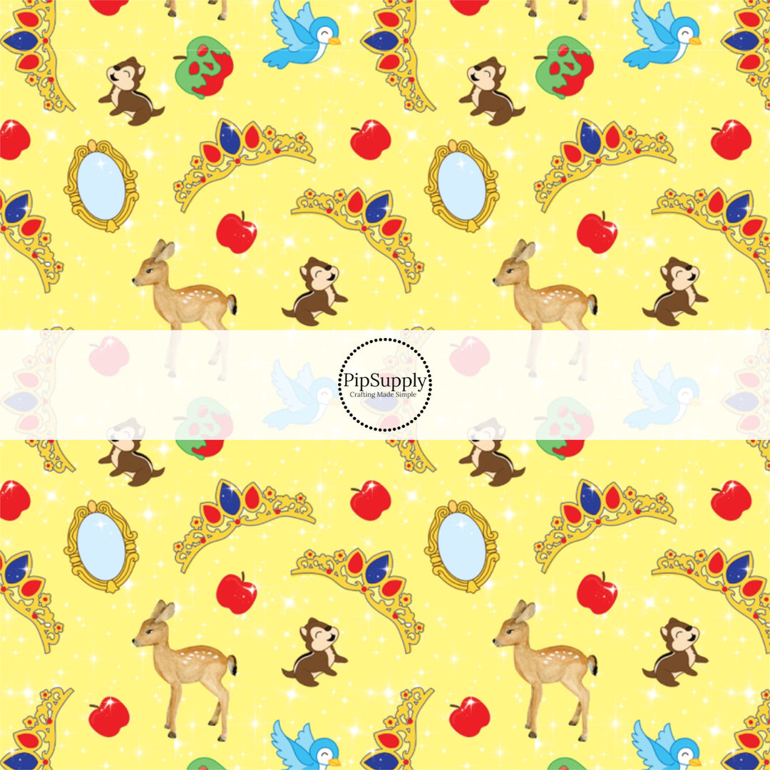 Yellow fabric by the yard with animals, apples, tiaras, and mirrors.