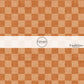 Orange faux linen fabric by the yard with a checker print pattern.