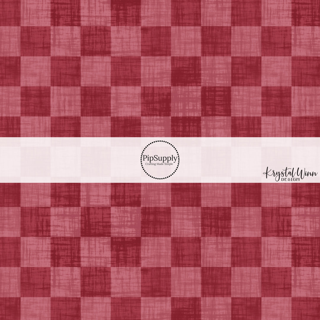 Cranberry red faux linen fabric by the yard with a checker print pattern.