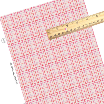 These Valentine's pattern themed faux leather sheets contain the following design elements: pink, purple, and red plaid on cream. Our CPSIA compliant faux leather sheets or rolls can be used for all types of crafting projects.