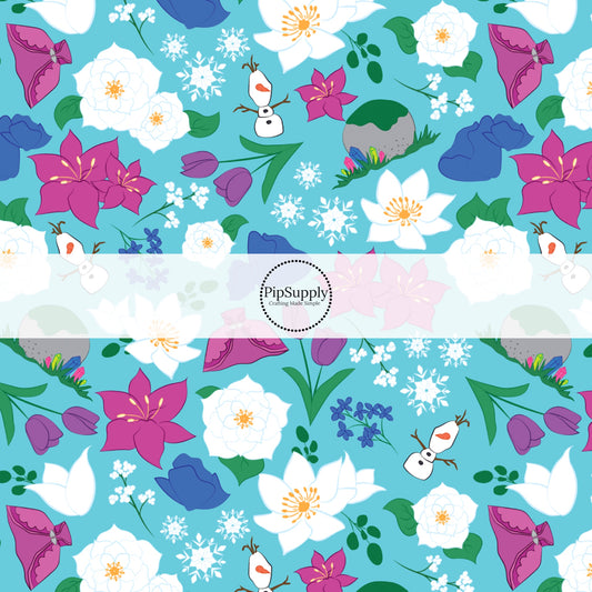 Blue princess fabric by the yard with snowflakes, snowmen, and floral designs.
