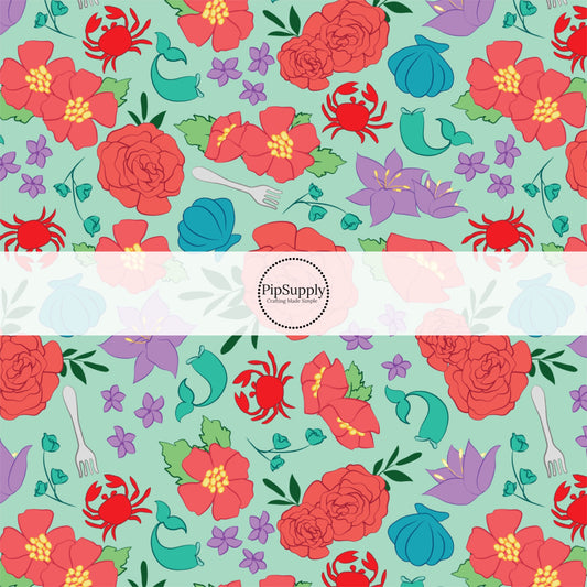 Teal green princess fabric by the yard with crabs, mermaid, tails, and floral designs.