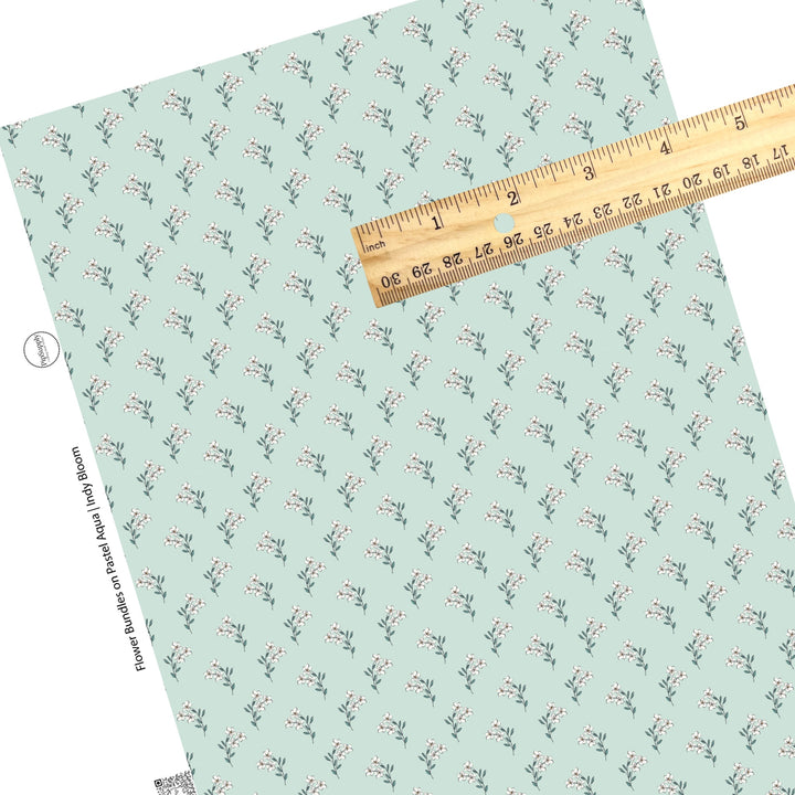 These Valentine's pattern themed faux leather sheets contain the following design elements: white flower bundles on pastel aqua. Our CPSIA compliant faux leather sheets or rolls can be used for all types of crafting projects.