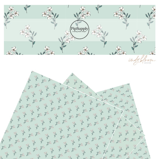 These Valentine's pattern themed faux leather sheets contain the following design elements: white flower bundles on pastel aqua. Our CPSIA compliant faux leather sheets or rolls can be used for all types of crafting projects.