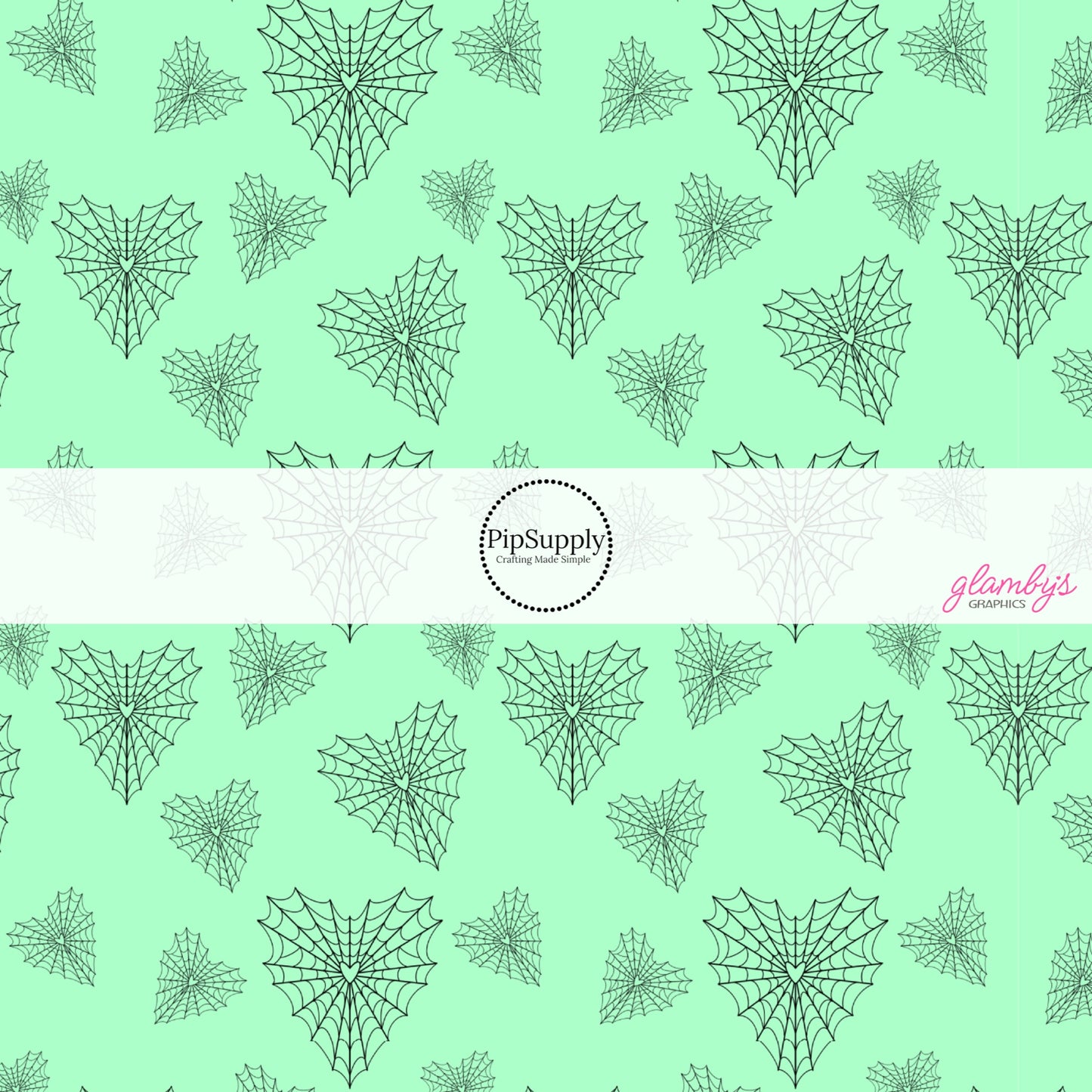 Mint green fabric by the yard with heart shaped spiderwebs.