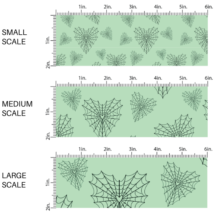 Mint green fabric by the yard scaled image guide with heart shaped spiderwebs.