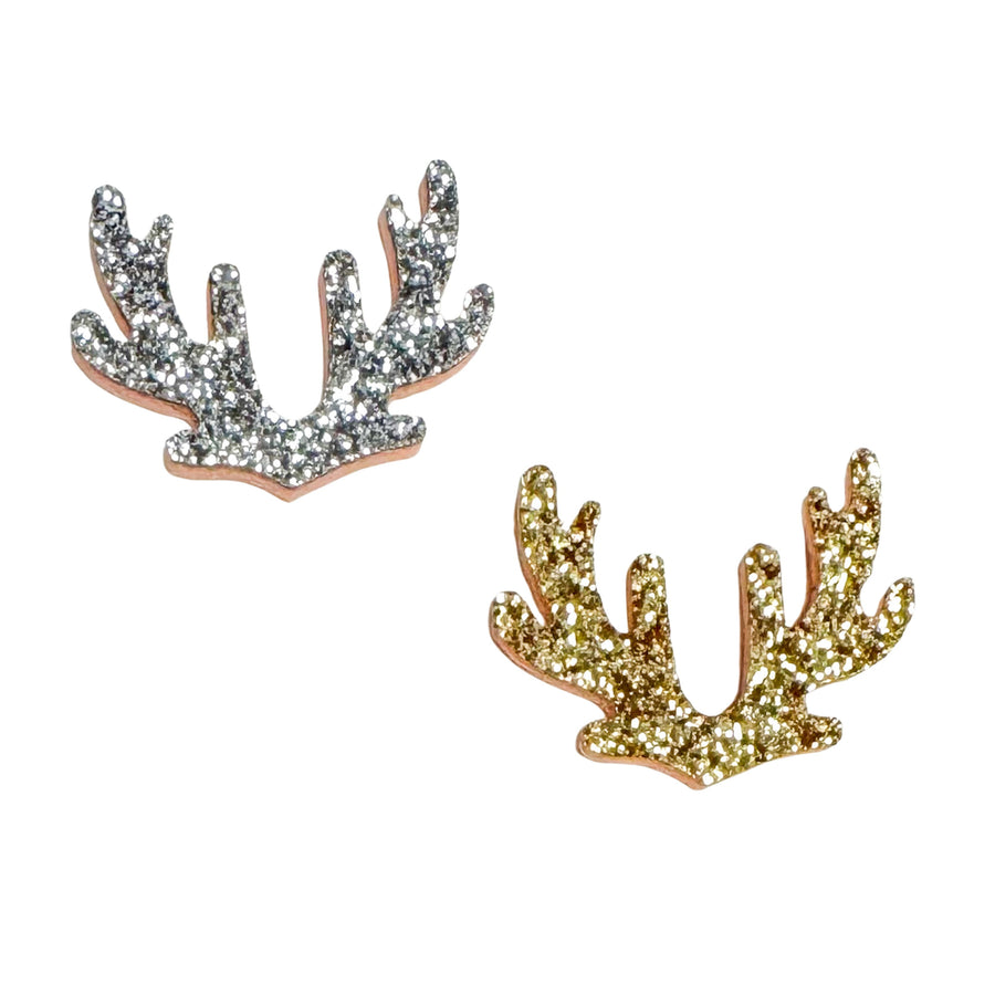 Glitter antler-shaped embellishments featuring a sparkling textured finish, available in silver and gold. These festive antlers have a whimsical silhouette with a felt backing, making them perfect for holiday crafts, hair bows, ornaments, gift toppers, and seasonal accessories.
Size: 1.5"

Material: Felt/Glitter

Price Per Piece

