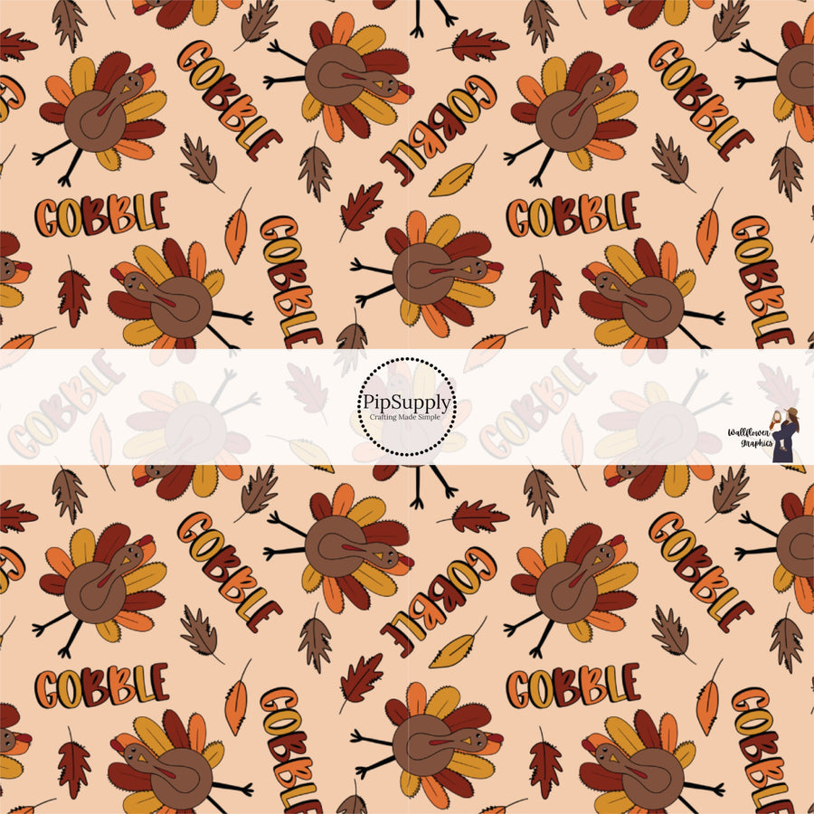 Tan fabric by the yard with the phrase "Gobble" and a Turkey.