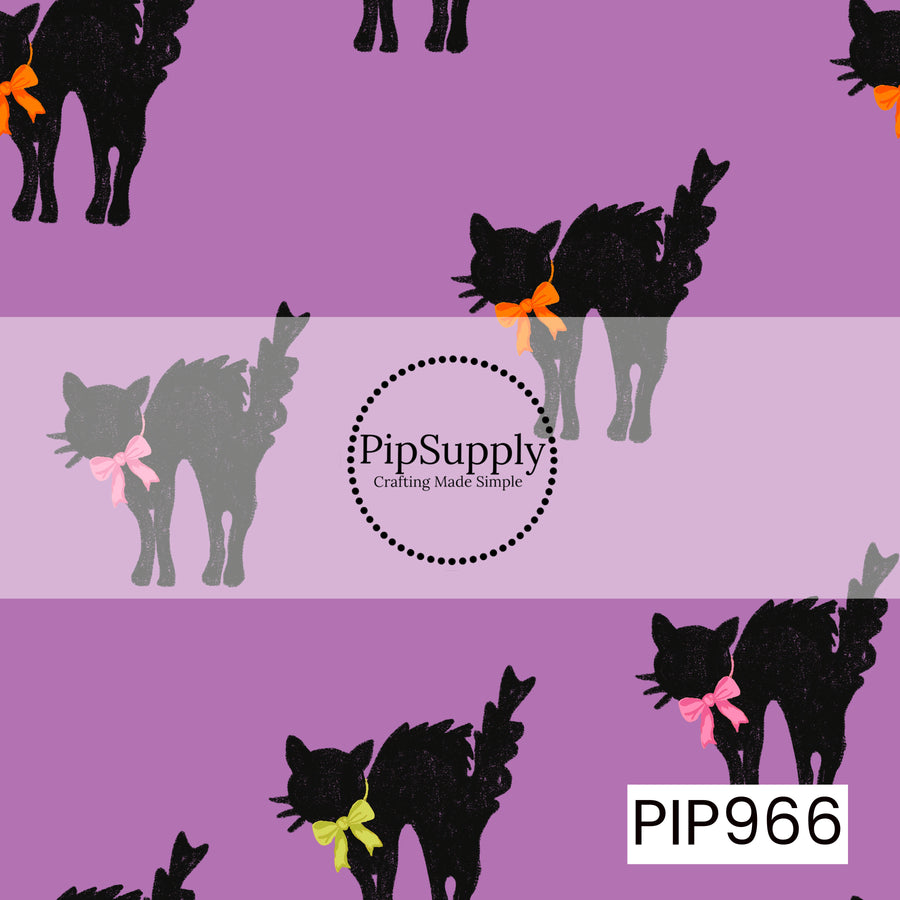 A seamless pattern featuring textured black cats with arched backs, each wearing a colorful bow in shades of orange, pink, or lime green, scattered across a soft purple background. The playful vintage-style cats create a whimsical Halloween design with bold contrast and charming details.
