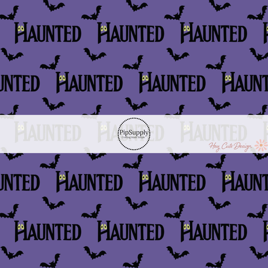 Purple fabric by the yard with phrase "Haunted" and black flying bats.