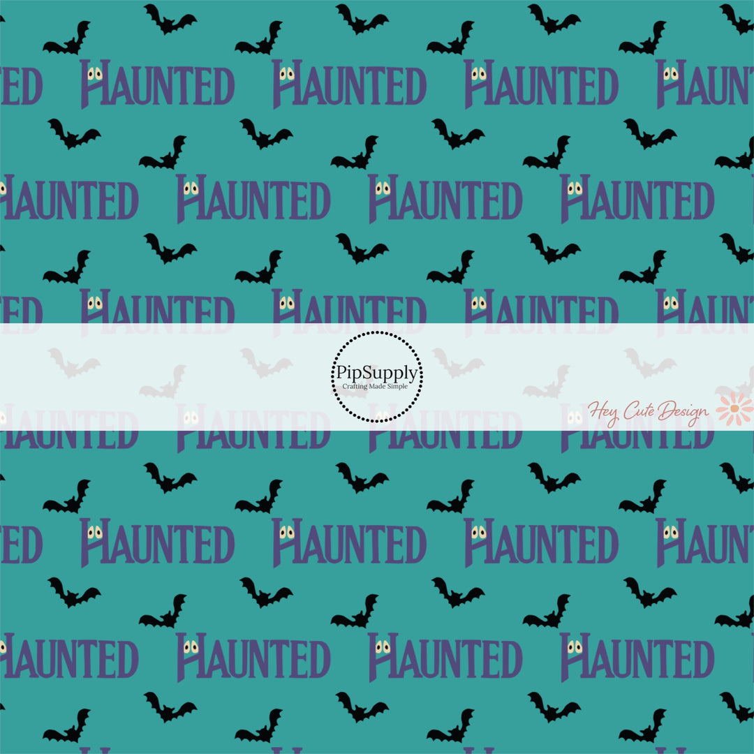 Teal Blue fabric by the yard with phrase "Haunted" and black flying bats.