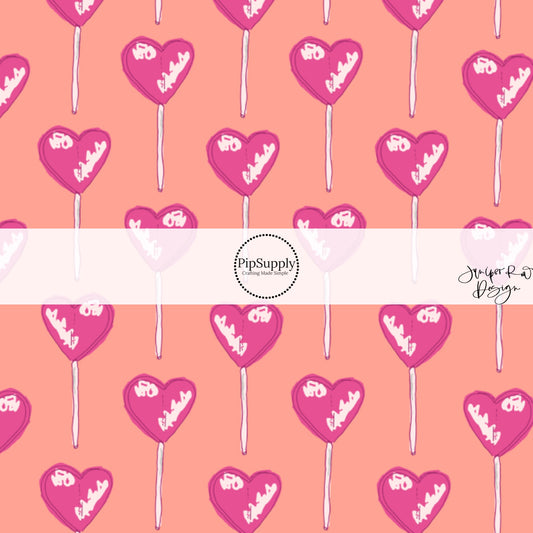 These Valentine's pattern themed fabric by the yard features pink lollipops on peach. This fun Valentine's Day fabric can be used for all your sewing and crafting needs! 