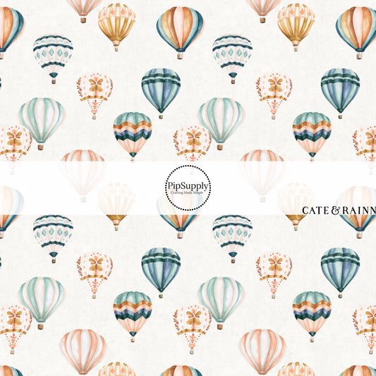 These hot air balloon pattern themed fabric by the yard features colorful hot air balloons on ivory. This fun pattern fabric can be used for all your sewing and crafting needs!