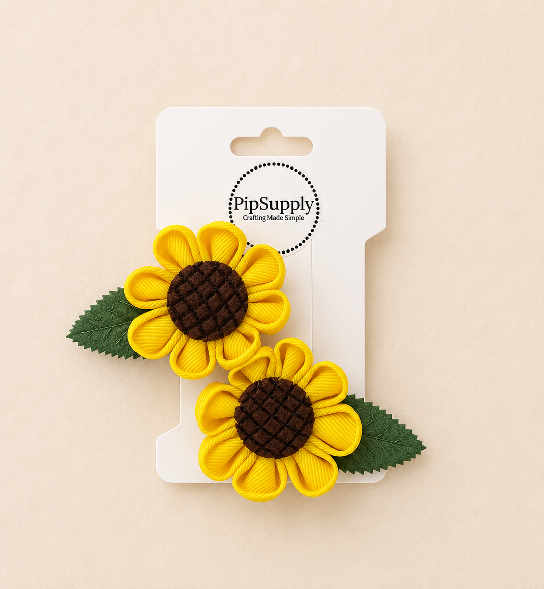 Two sunflower-shaped hair clips sized approximately 2.25"