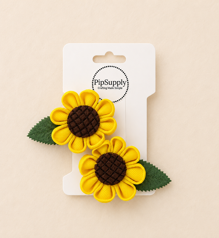 Two sunflower-shaped hair clips sized approximately 2.25"