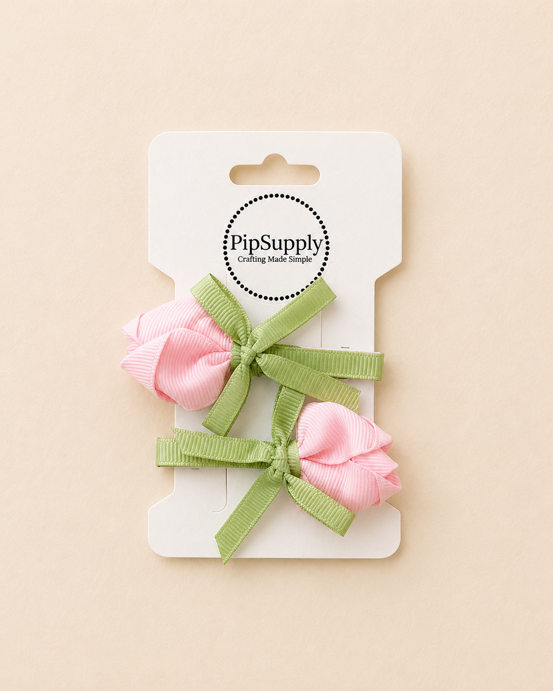 Two pink hair bows with green ribbons on a hair clip in the shape of a tulip flower. size is approximately 2.25"