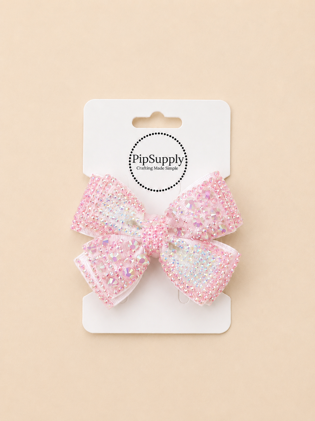 White with opalescent pink rhinestone hair bow with a hair clip sized approximately 4"