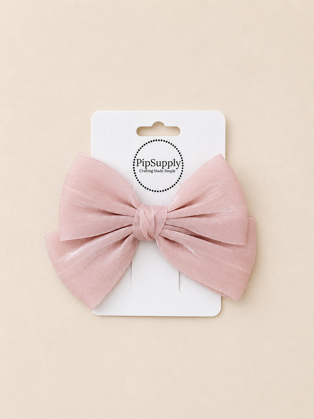 Pink tulle hair bow with a hair clip sized approximately 4"