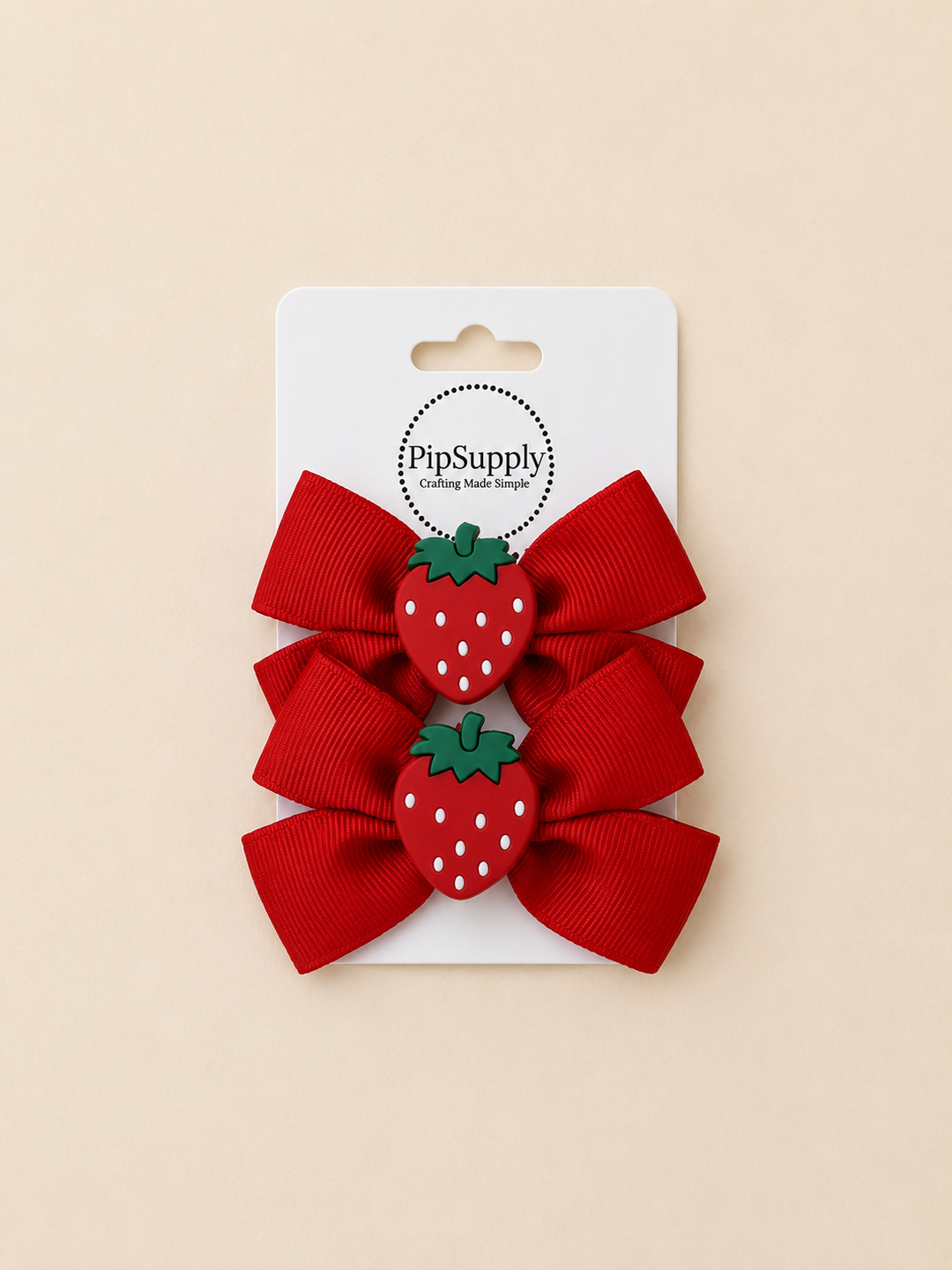 Two red hiar bows with strawberry centers on hair clips. Sized approximately 3.25"