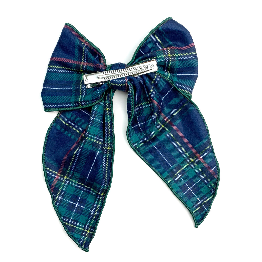 Theses holiday flannel plaid serged edge hair bows are ready to package and resell to your customers no sewing or measuring necessary! These come pre-tied with an attached clip. These Christmas bows are perfect for all hair styles for kids and adults.