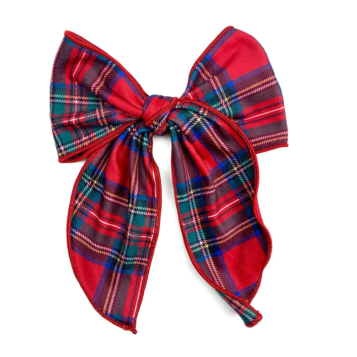 Theses holiday flannel plaid serged edge hair bows are ready to package and resell to your customers no sewing or measuring necessary! These come pre-tied with an attached clip. These Christmas bows are perfect for all hair styles for kids and adults.