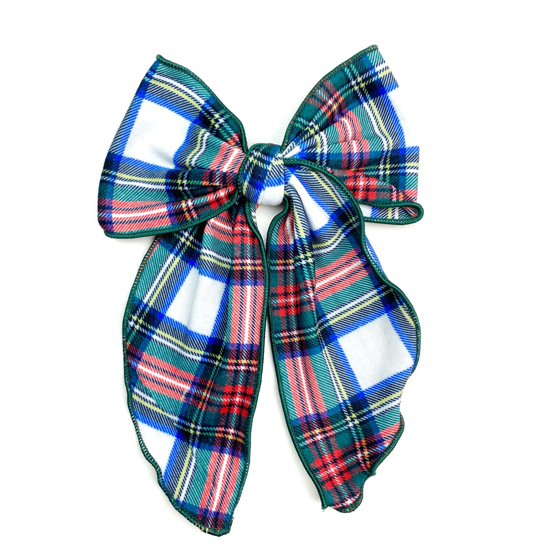 Theses holiday flannel plaid serged edge hair bows are ready to package and resell to your customers no sewing or measuring necessary! These come pre-tied with an attached clip. These Christmas bows are perfect for all hair styles for kids and adults.