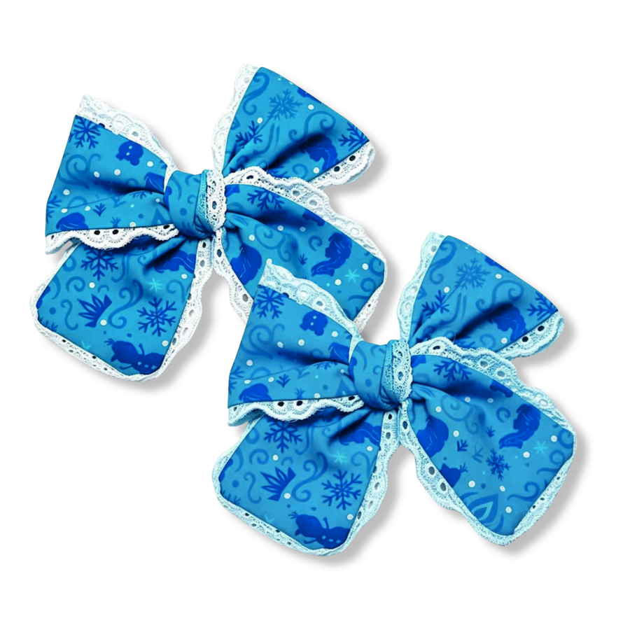 These charming boutique bows feature a vibrant blue winter-inspired print adorned with snowflakes, swirling accents, and whimsical silhouette details. Delicate white lace or blue trim is layered throughout the design, adding soft texture and vintage-inspired charm. The classic bow shape and frosty color palette create a magical accessory perfect for winter and seasonal styles.
You choose color of lace trim
Small 5" X 6"