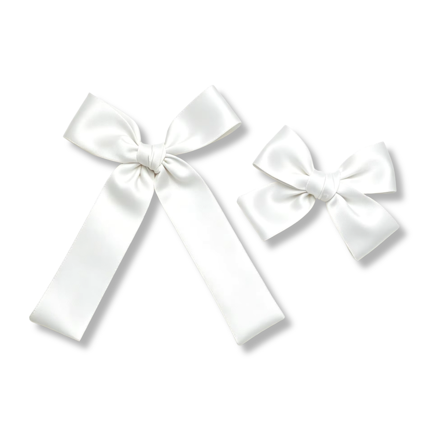 A classic satin bow crafted from crisp white ribbon with a smooth, luxurious sheen. Featuring beautifully shaped loops, a neatly wrapped center knot, and elegant flowing tails, this timeless design offers a clean, sophisticated look that pairs effortlessly with any outfit or occasion.
two sizes
Small Bow Sizing 4.5" x 4.5"
Large Bow Sizing 5.5" x 7"