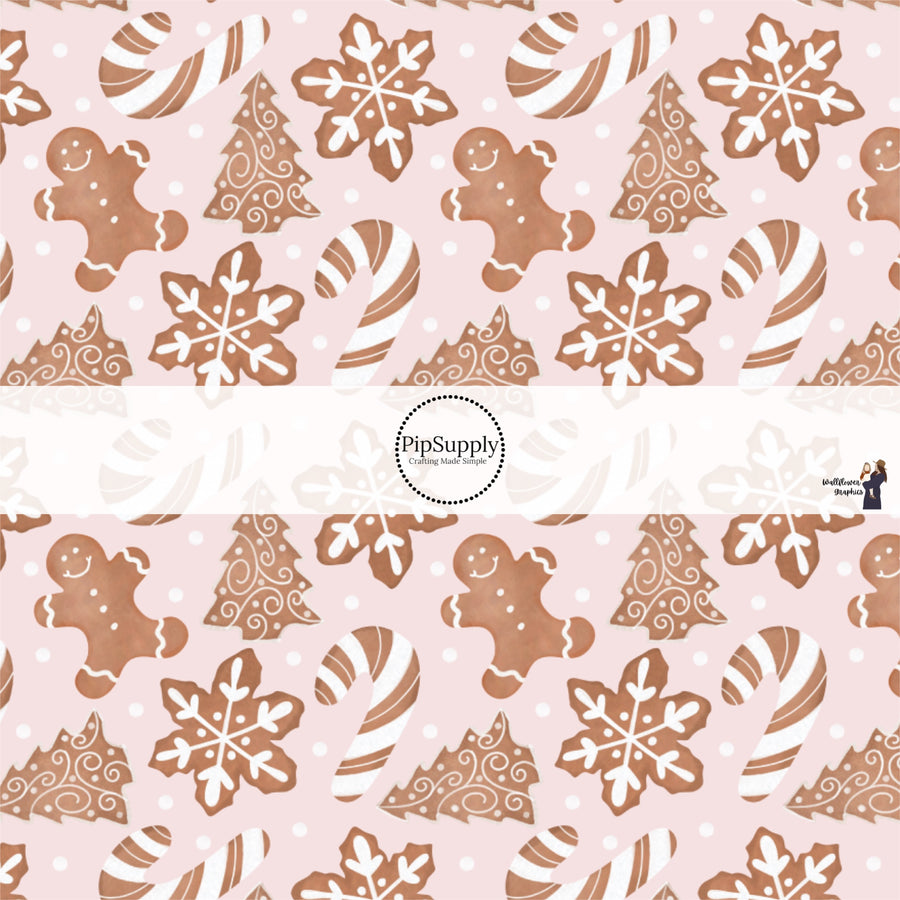 These holiday pattern themed fabric by the yard features iced gingerbread cookies on light pink. This fun Christmas fabric can be used for all your sewing and crafting needs!