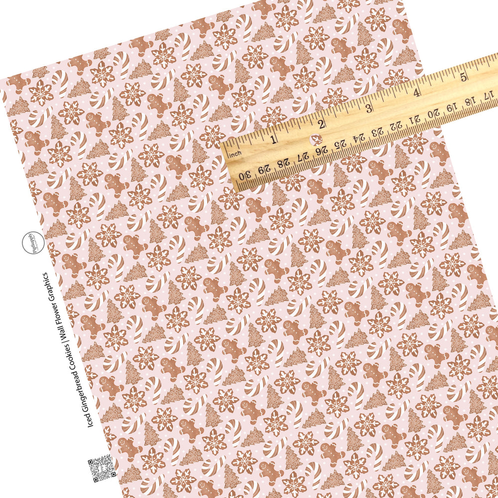 These holiday themed faux leather sheets contain the following design elements: iced gingerbread cookies on light pink. Our CPSIA compliant faux leather sheets or rolls can be used for all types of crafting projects.