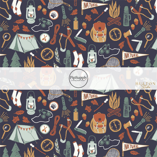 These fall themed fabric by the yard features outdoor adventure items on dark blue. This fun autumn themed fabric can be used for all your sewing and crafting needs! 