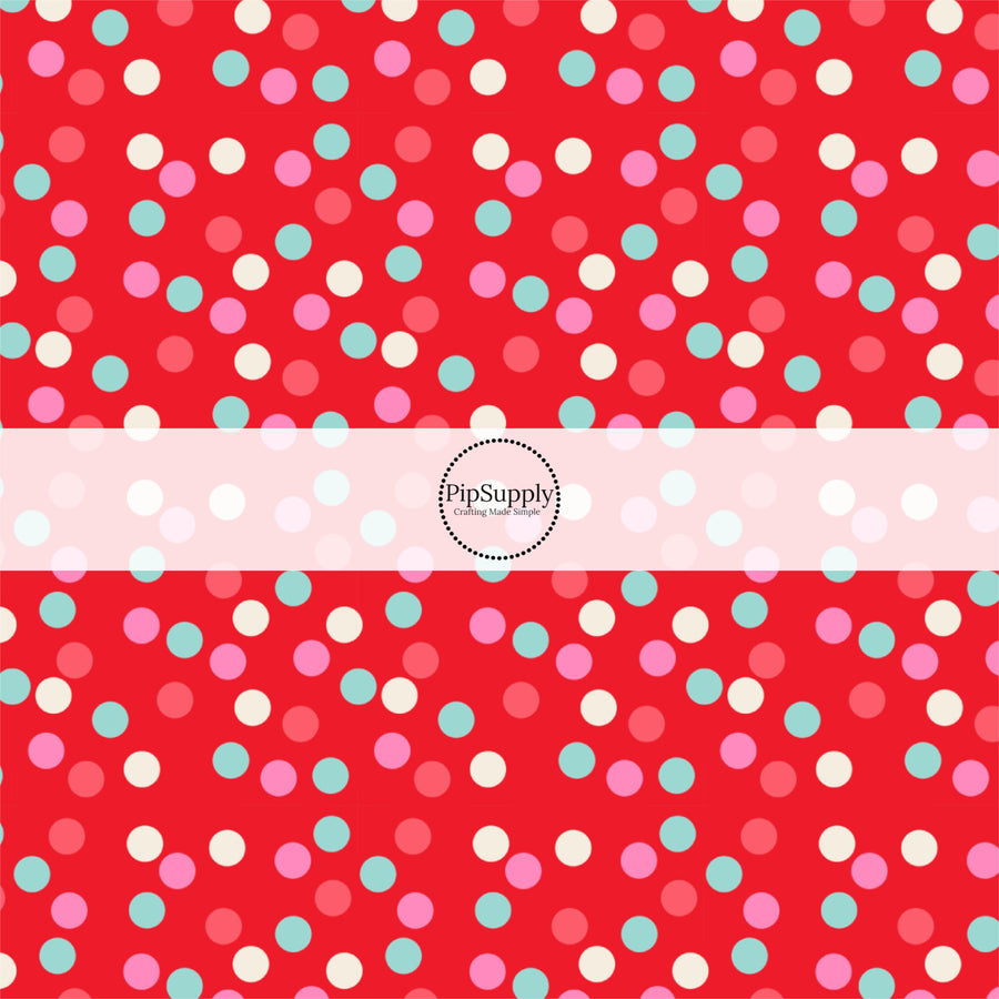 These holiday pattern themed fabric by the yard features light pink, white, and teal dots on red. This fun Christmas fabric can be used for all your sewing and crafting needs!