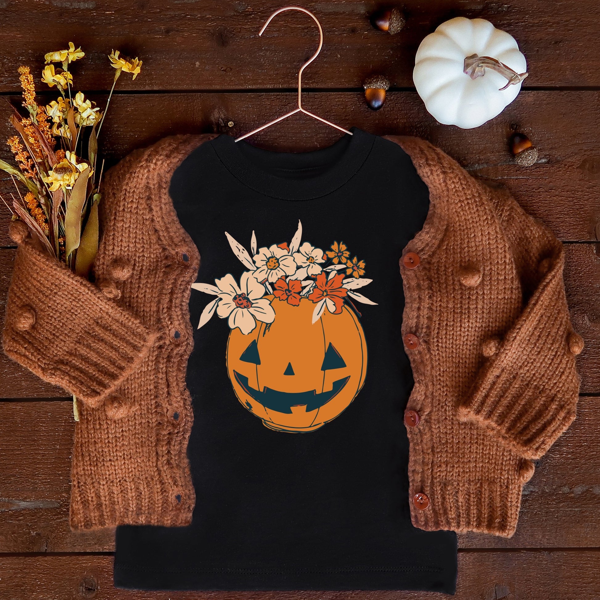 Orange Jack-O-Lantern with cream and orange florals iron on DTF and sublimation tramsfers.