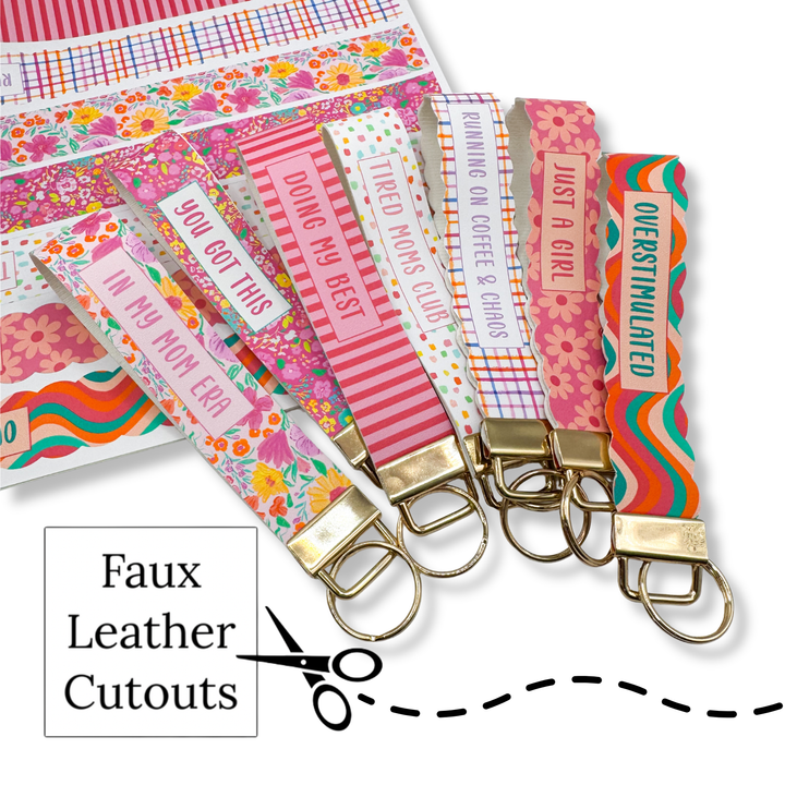 Colorful faux leather cutouts with text and keychains on a white background