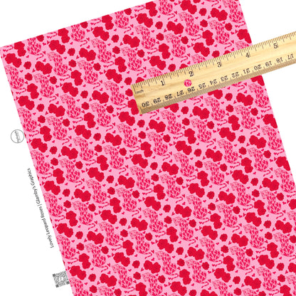 These Valentine's pattern themed faux leather sheets contain the following design elements: leopards with red hearts surrounded by red roses on pink. Our CPSIA compliant faux leather sheets or rolls can be used for all types of crafting projects.