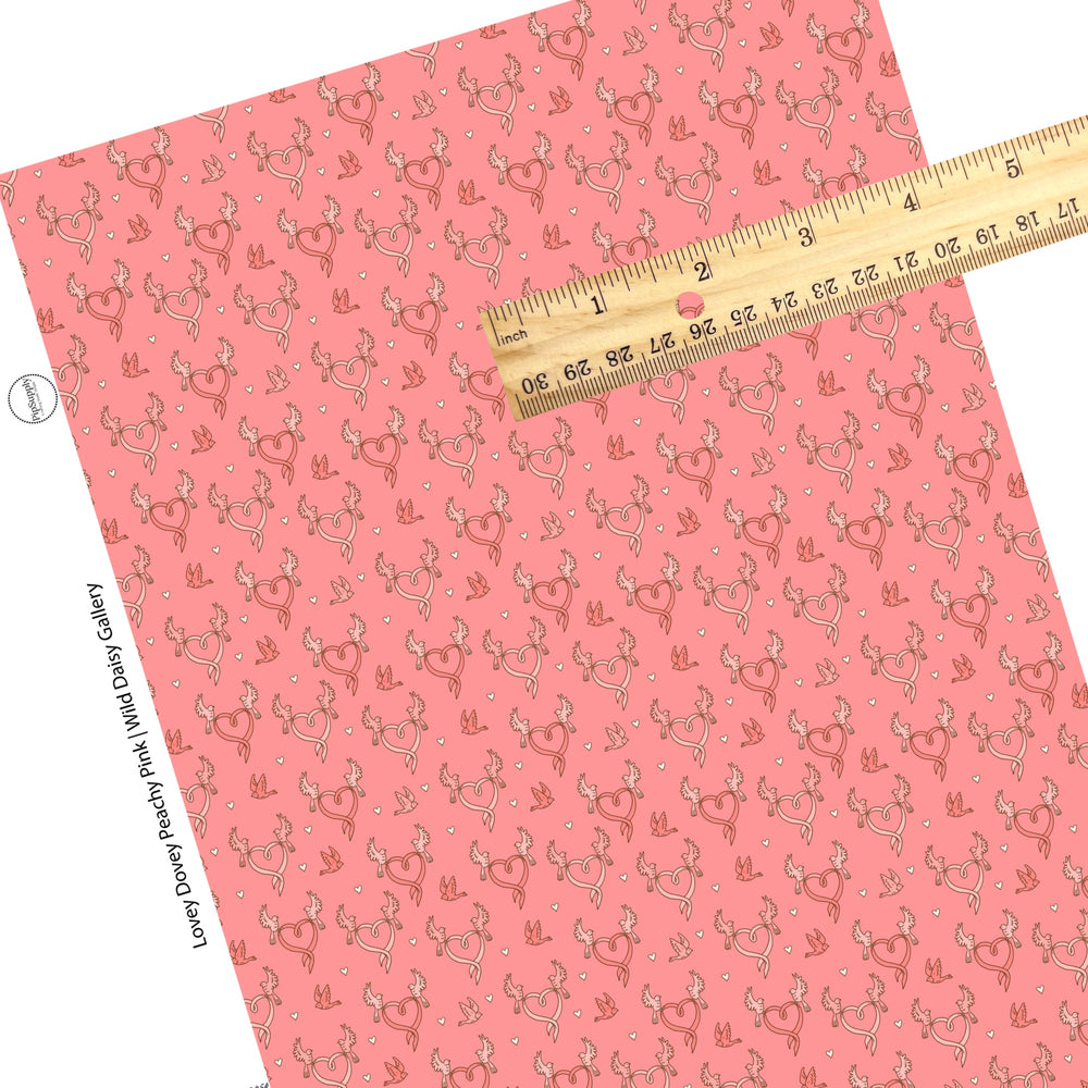 These Valentine's pattern themed faux leather sheets contain the following design elements: pink dove birds with ribbon hearts on peachy pink. Our CPSIA compliant faux leather sheets or rolls can be used for all types of crafting projects.