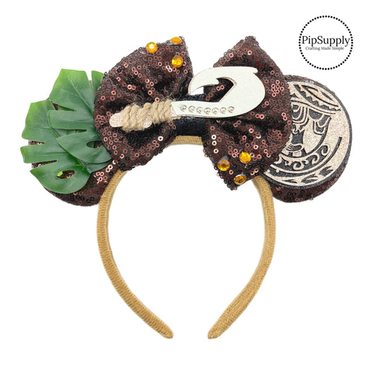 These Hawaiian themed mouse ear headbands are a stylish hair accessory. These comfortable headbands have an attached brown glitter bow and brown glitter mouse ears. Along with rhinestones, leaves, Hawaiian cutouts, and a hook embellishment. This hair accessory comes completely assembled and is great for park vacations, costumes or for everyday wear!