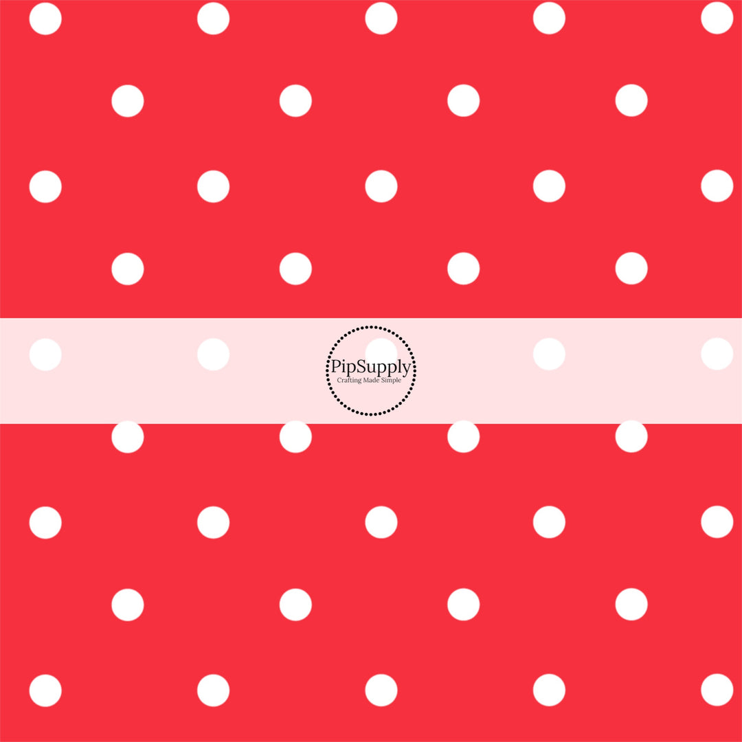 Red fabric by the yard with small white polka dots.