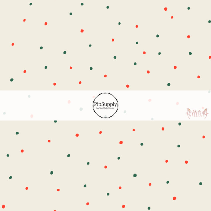 Cream fabric by the yard with red and green speckled dots.