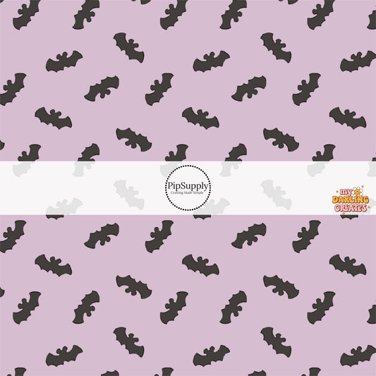 Lilac purple fabric by the yard with scattered bats with mouse ears.