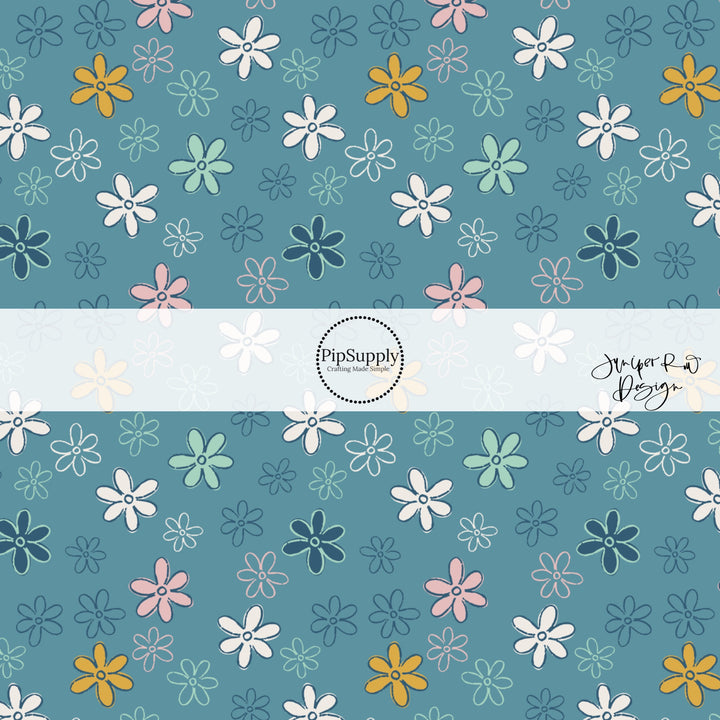 Blue fabric by the yard with pink, navy blue, white, and aqua doodled daisies.