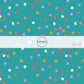 Teal fabric by the yard with white, pink, yellow, pink, and purple scattered stars.