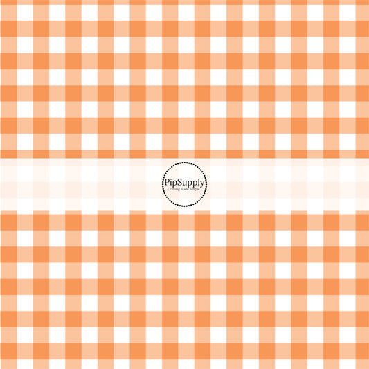 Orange and white gingham plaid print fabric by the yard.