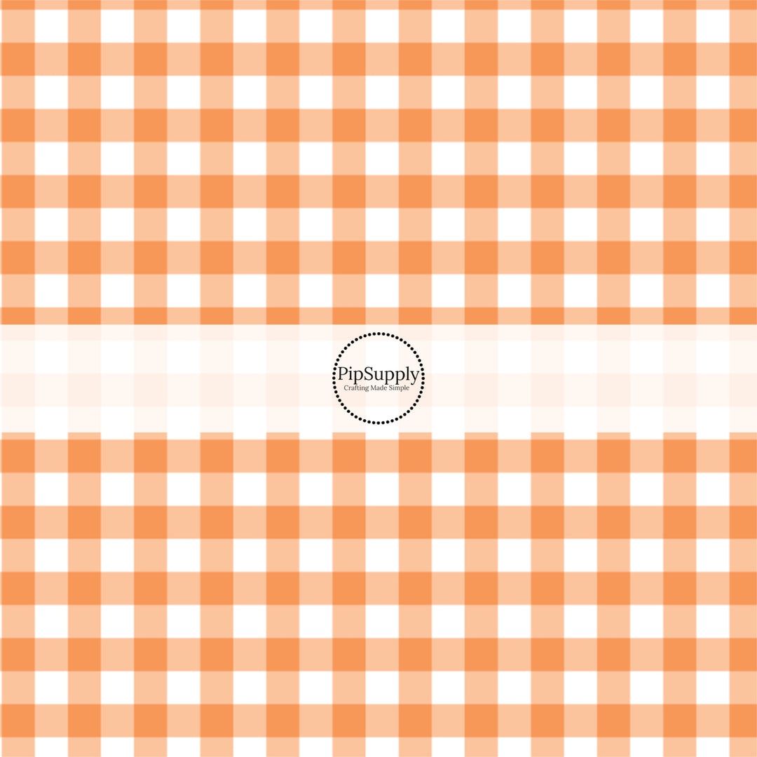 Orange and white gingham plaid print fabric by the yard.