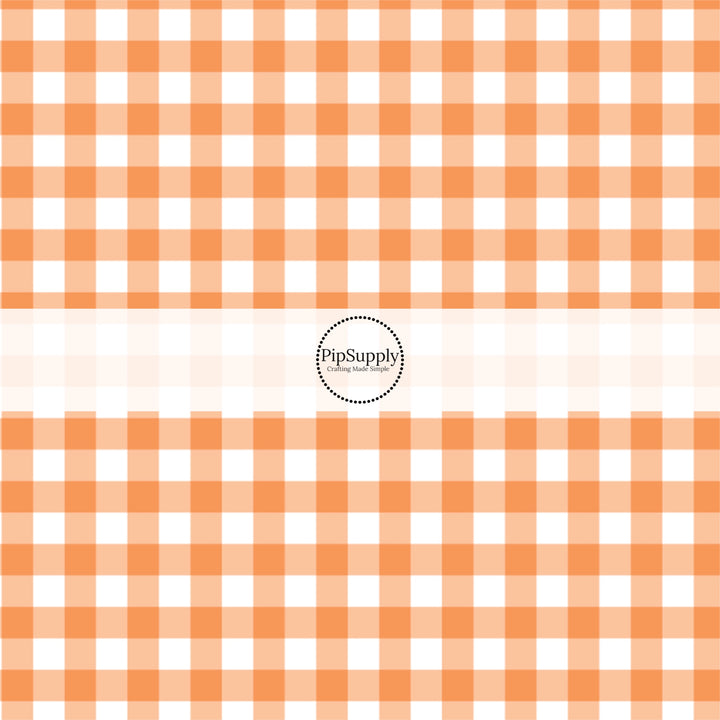 Orange and white gingham plaid print fabric by the yard.