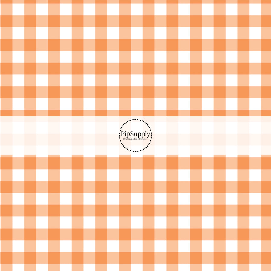 Orange and white gingham plaid print fabric by the yard.