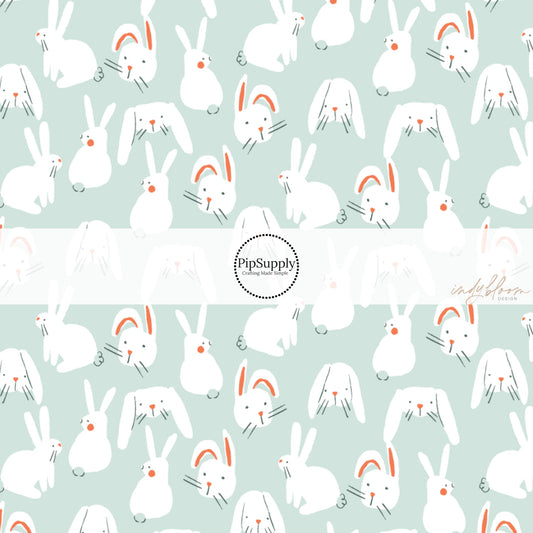 White Bunnies on Pale Sea-foam Green Fabric by the Yard.
