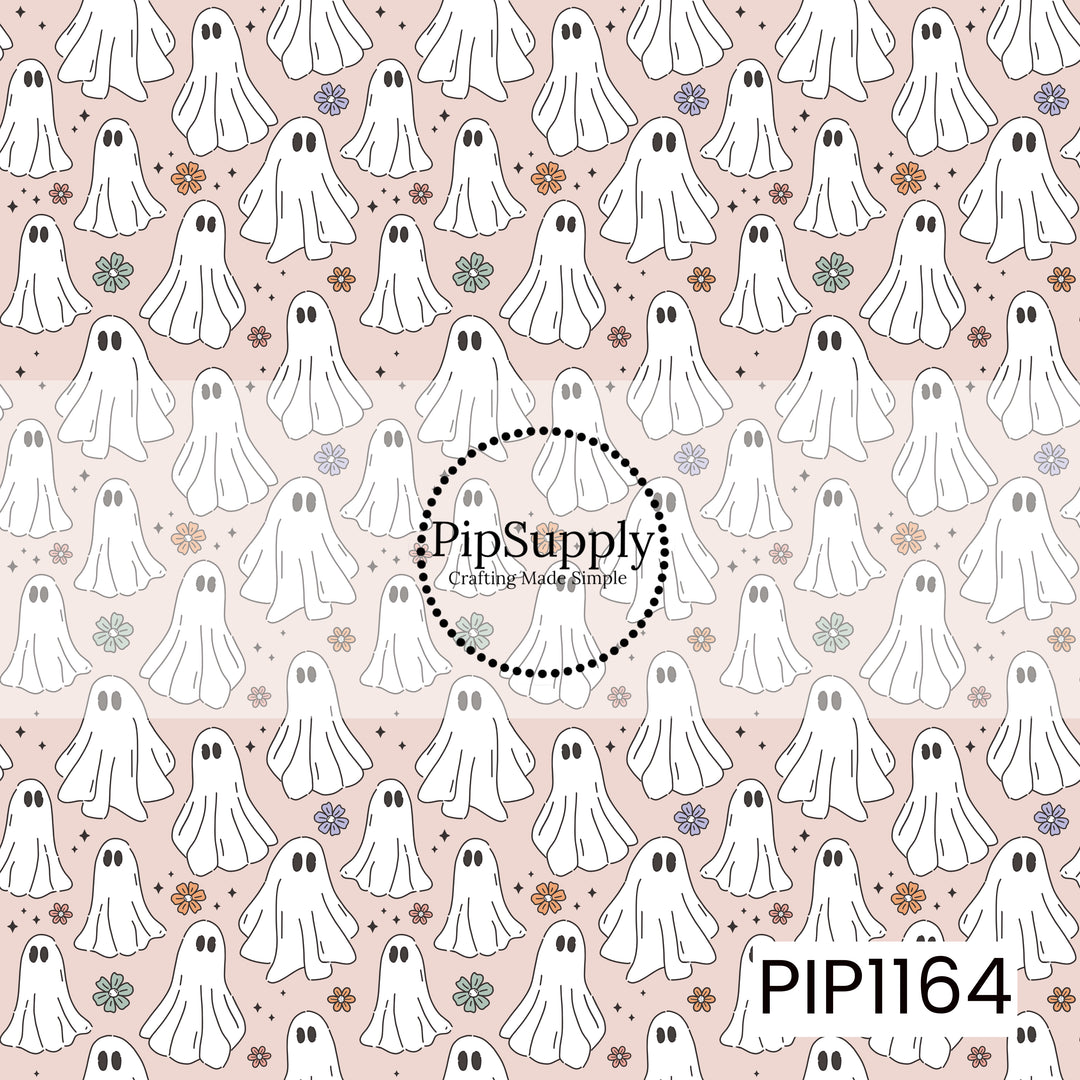 A playful ghost pattern featuring hand-drawn white ghosts, tiny black stars, and scattered florals in lavender, orange, coral pink, and sage green on a soft blush pink background.

