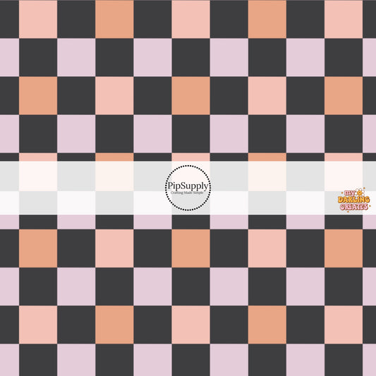 Black, pink, and orange checkered print fabric by the yard.